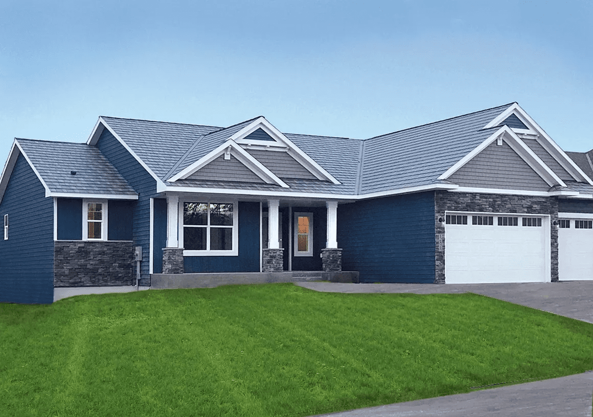 Modern blue house with green lawn