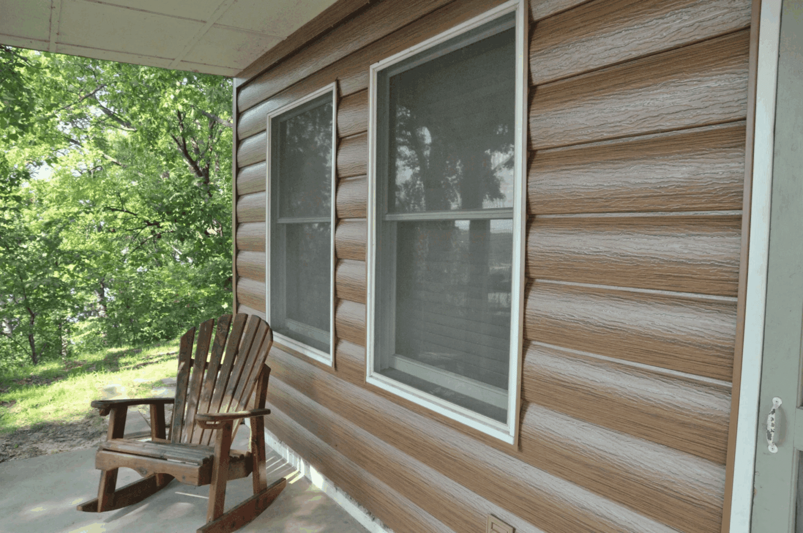 Log cabin exterior with chair